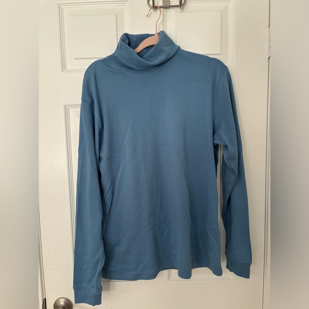 blue turtleneck.